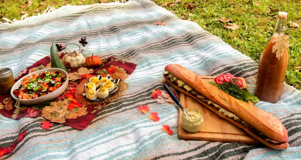 A picnic meal on a blanket including 